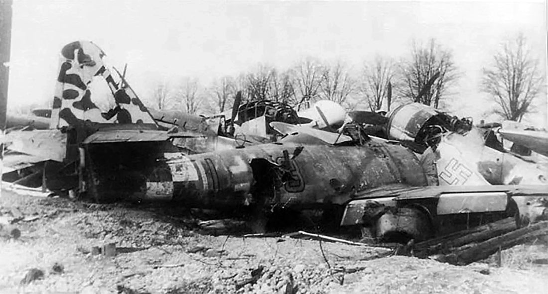 Airframe of Me 262 A-1a, W.Nr. 170305, 'Yellow 3+I' (7./KG(J) 54) at a wrecked aircraft boneyard.